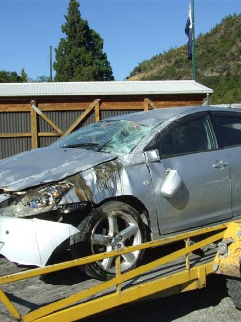 Police were looking for this car's driver yesterday after it was found on its roof in Manse Rd....