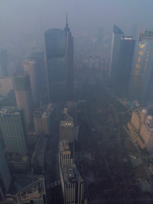 Pollution creates a thick haze in the central business district in Guangzhou, Guangdong province....