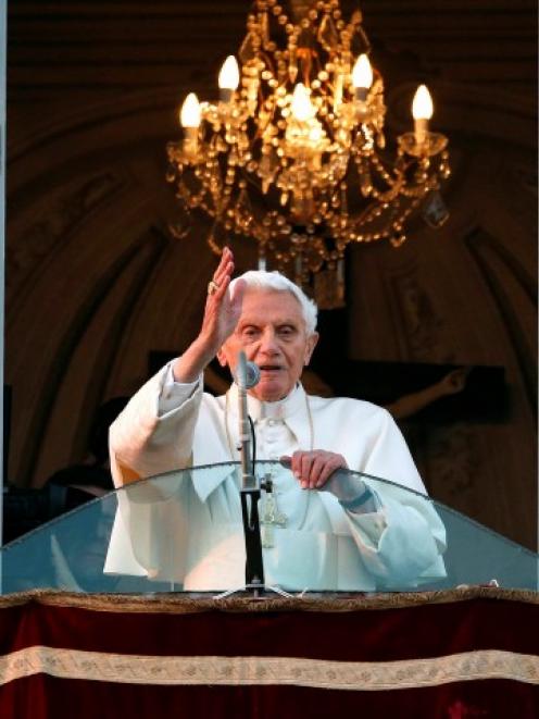 Pope Benedict XVI blesses the faithful for the last time from the balcony of his summer residence...