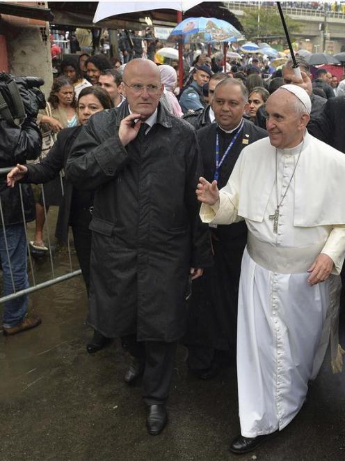 Pope Francis visits the Varginha slum in Rio de Janeiro. REUTERS/Luca Zennaro/Pool (BRAZIL - Tags...