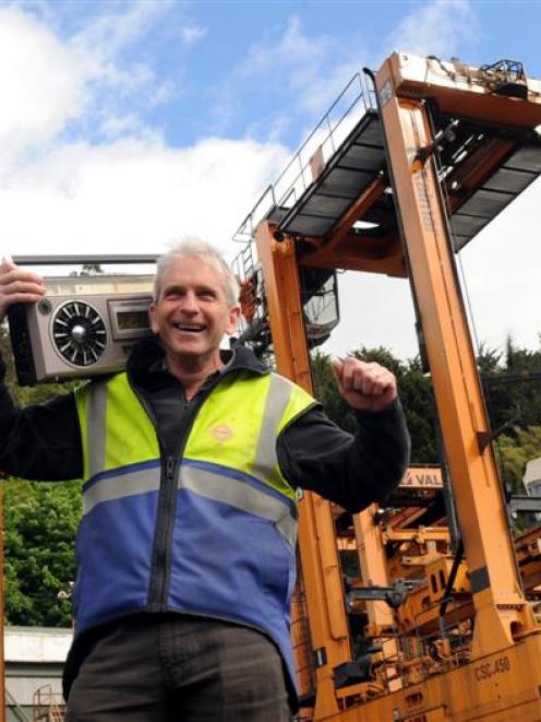 Port Otago maintenance planner Murray Hyslop with Elton the straddle carrier yesterday. Photo by...