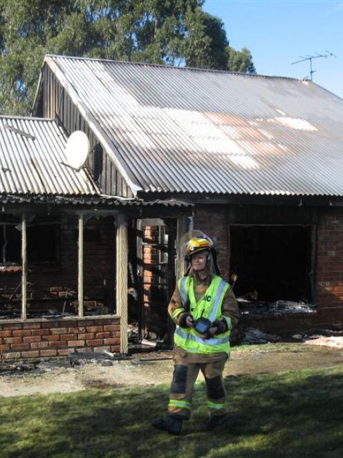 Portobello volunteer firefighters at the scene of a fire on Harwood St, yesterday morning.  Photo...