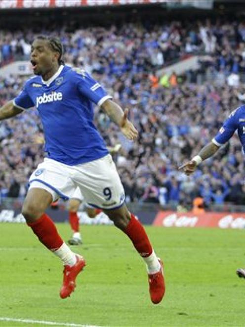 Portsmouth's Fredrique Piquionne, left, celebrates with Kevin Prince Boateng during the FA Cup...