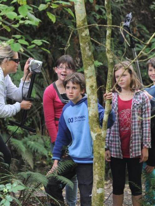 Preparing another scene in their film <i>Toxic</i>, at Ross Creek yesterday are Waitati School...