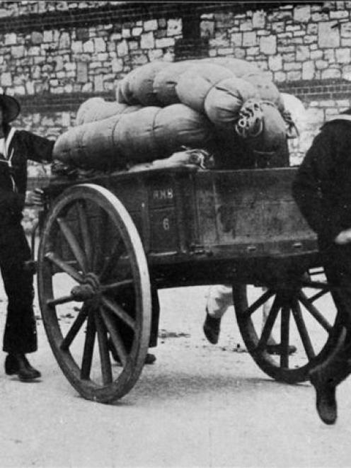 Preparing for the assembly of the British fleet off Portsmouth: Jack Tars conveying kits to the...