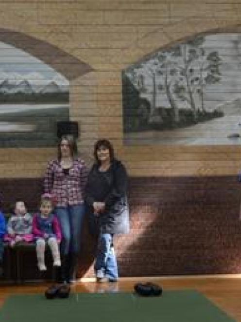 Preparing to celebrate the 100th anniversary of the Momona Hall are (from left) Keith Ruthven,...