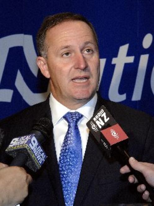 Prime Minister John Key fields questions from media after the National Party Mainland Region...
