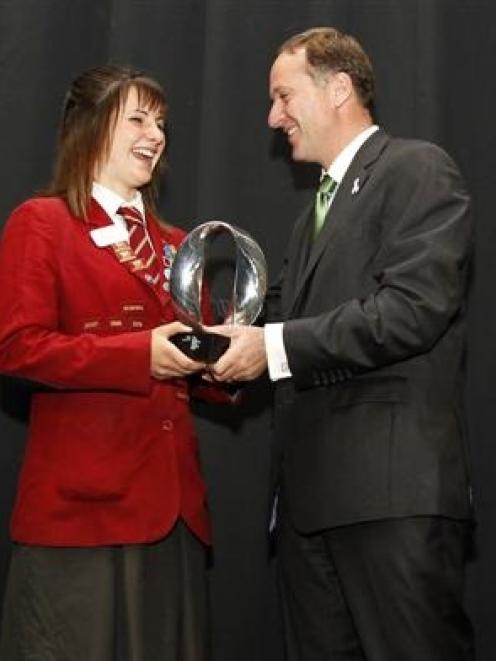 Prime Minister John Key presents the Future Scientist Prize to James Hargest College pupil Bailey...