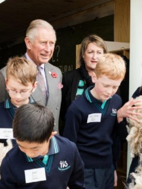 Prince Charles and Campaign For Wool New Zealand Trust chairwoman Philippa Wright with pupils...