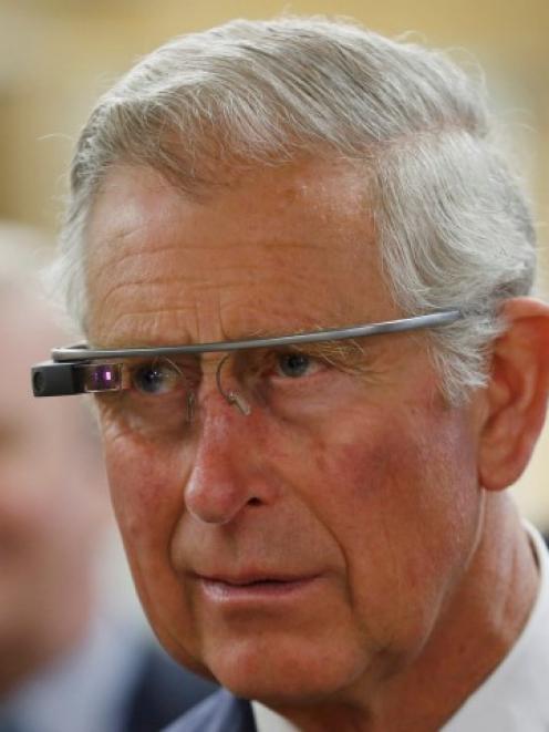 Prince Charles tries a pair of Google glasses to use software developed at an innovation centre...