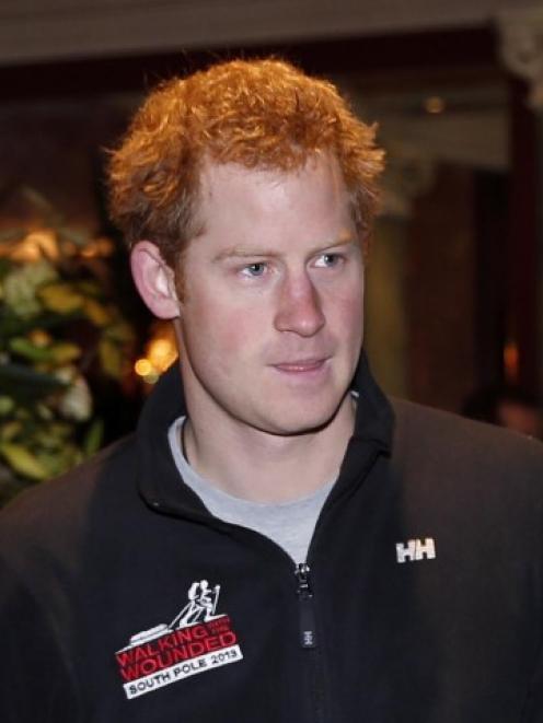 Prince Harry arrives at a London news conference last month to welcome home members of the ...