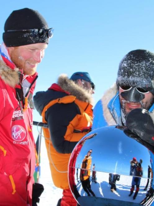 Prince Harry arrives at the South Pole with other members of the expedition. REUTERS/Walking With...