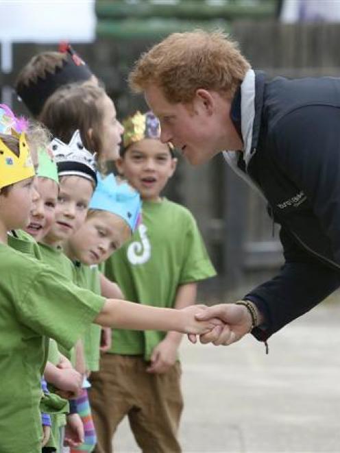 Prince Harry  greets Halfmoon Bay school pupils during his recent visit to Stewart Island. Photo...