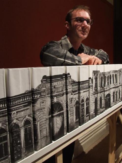 Printmaker Manu Berry displays his Harbour St streetscape. Photo by Sally Rae.