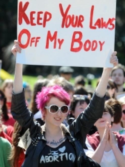 Pro-choice supporters protest outside the Court of Appeal in Wellington, demanding the repeal of...