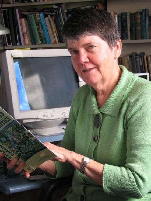 Prof Judith Bennett, of the University of Otago history department, examines a copy of her latest...