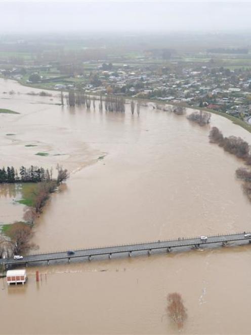 Protected by behind a floodbank, Outram is flanked by the flooding  Taieri River on Saturrday....