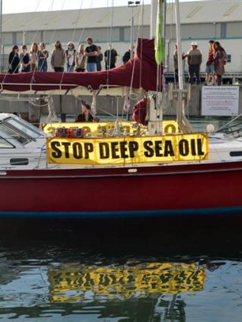 Protest yacht SV Tiama berths with its motor running in Dunedin yesterday. Photo by Stephen...