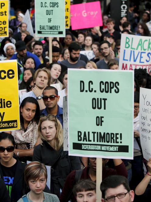 Protesters against police violence stop traffic at a major intersection in the Chinatown...