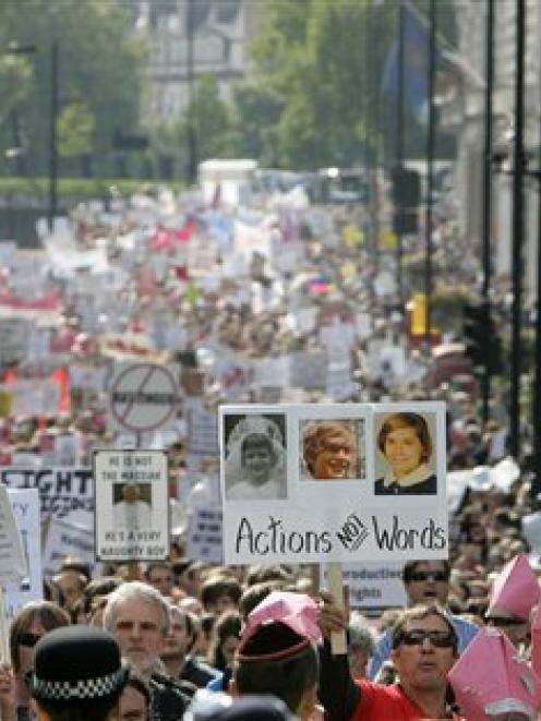 Protesters against Pope Benedict XVI's state visit to Britain march in central London. (AP Photo...