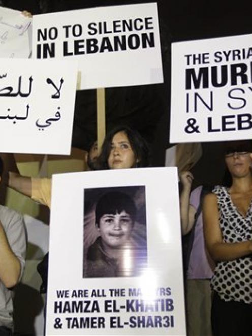 Protesters against the Syrian regime stage a a vigil sit-in to show support to the Syrian...