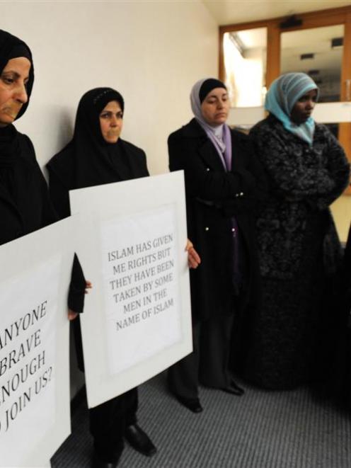 Protesters and onlookers outside a meeting organised for Islam Awareness Week at the University...