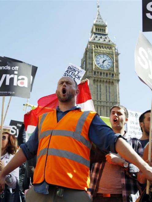 Protesters in Parliament Square in central London demonstrate against possible strikes on the...