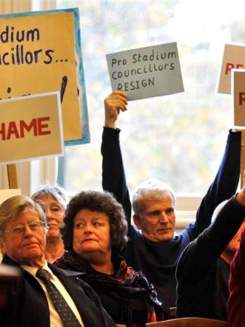 Protesters including former Stop the Stadium president Bev Butler (second from left) show their...