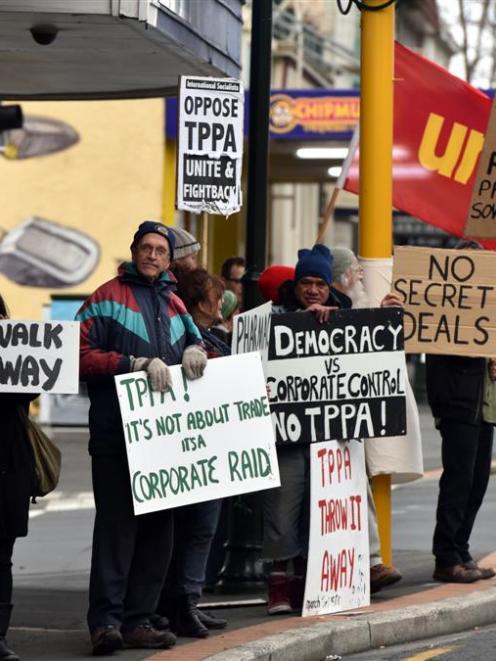 Protesters stand in Princes St, Dunedin, outside the office of Cabinet Minister Michael Woodhouse...