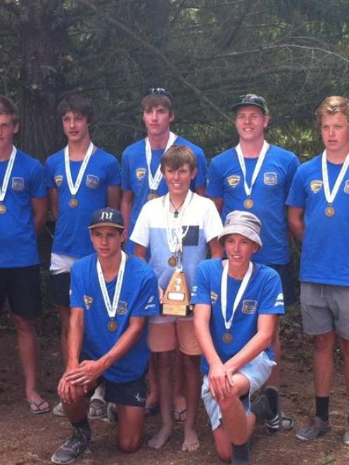 Proudly displaying their medals with coach Andrew Jolly are the Wakatipu Rowing Club under-18...