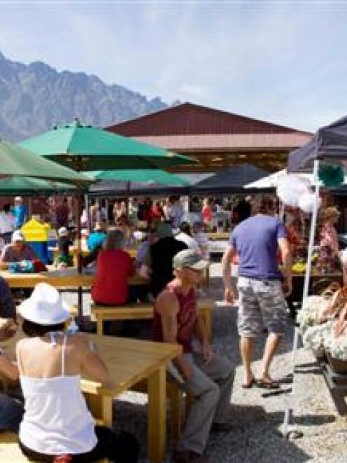 Punters enjoy a summer's day during the Remarkables Market's successful second season. The market...