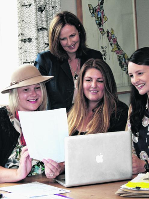 Putting last-minute details in place are (front) Amie Richardson, Amanda Milne and Victoria Muir....