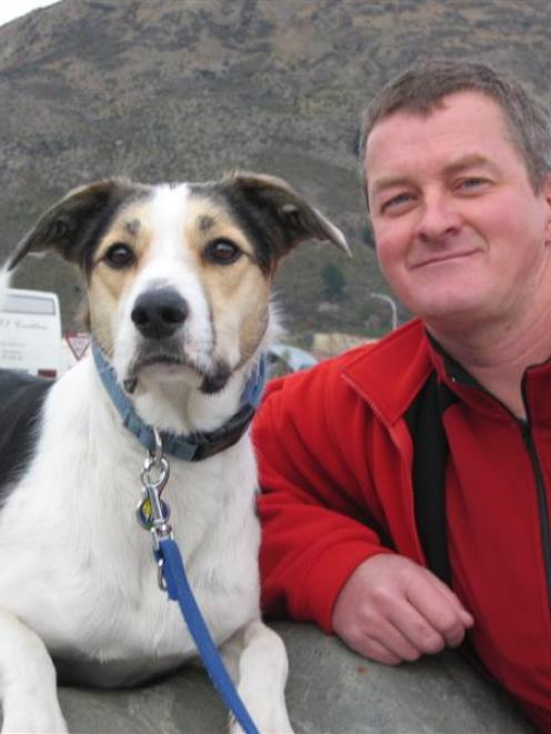 Fin the search and rescue dog found Ms Okin's backpack for his owner, Dermot Mayock. Photo by...
