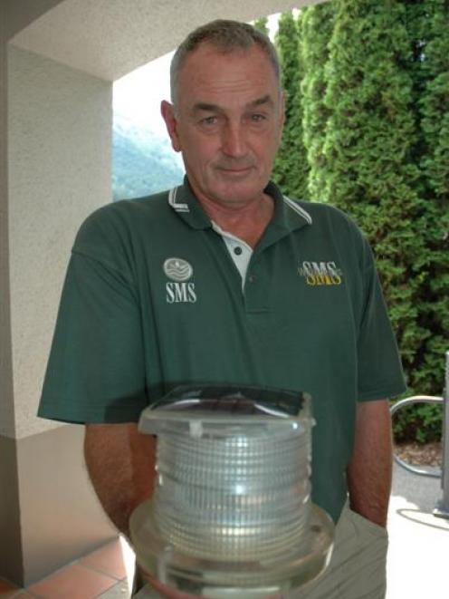 QLDC deputy harbourmaster Dave Black holds a beacon similar to the one stolen from Lake Wakatipu...