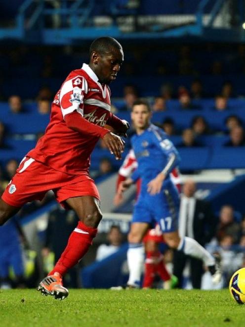 QPR's Shaun Wright-Phillips shoots to score against Chelsea during their English Premier League...