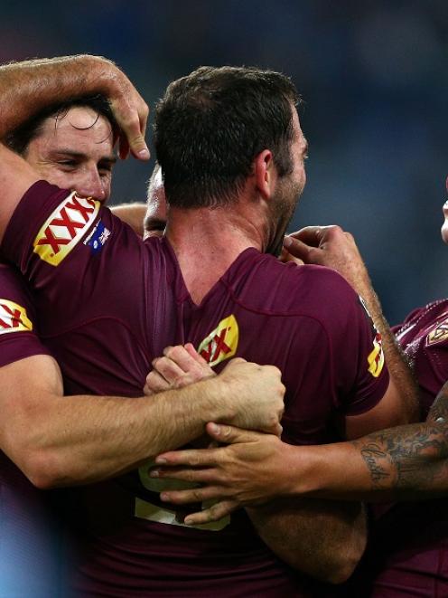 Queensland players celebrate their win over New South Wales. Photo Getty