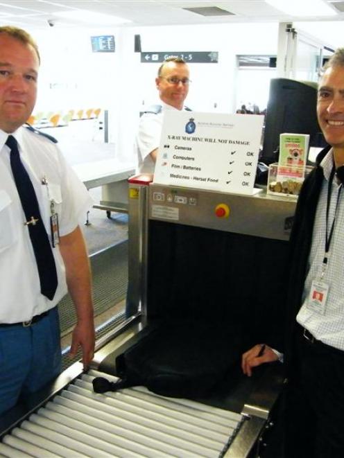 Queenstown Airport aviation security officers Athol Murray (left) and Paul Franklin (centre), and...