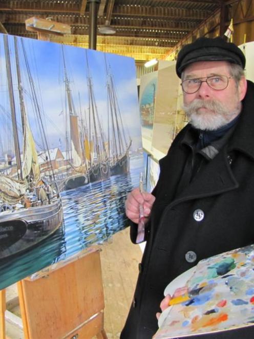 Queenstown artist and illustrator Spike Wademan stands beside <i>The Photographer</i> (2010), his...
