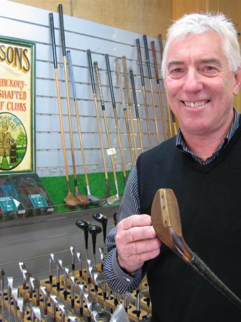 Queenstown golf professional Allan McKay with an Alex Patrick long-nosed play club from 1880....