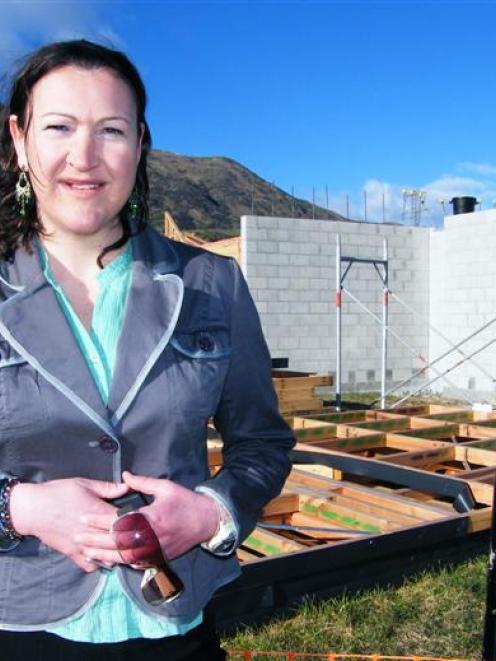 Queenstown Lakes Community Housing Trust executive officer Julie Scott stands beside the trust's...