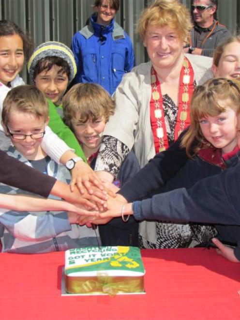 Queenstown Lakes  Mayor Vanessa van Uden and local schoolchildren cut a cake celebrating five...