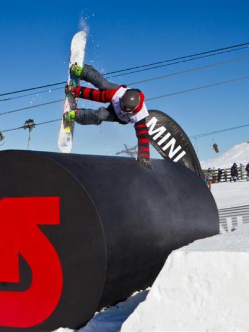 Queenstown local Nick Hyne pulls a "Miller Flip" inverse hand-plant trick during yesterday's...