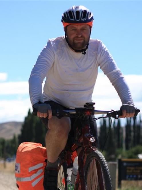Queenstown man Carey Vivian  near Chatto Creek on day 29 of his length of the country bike ride....