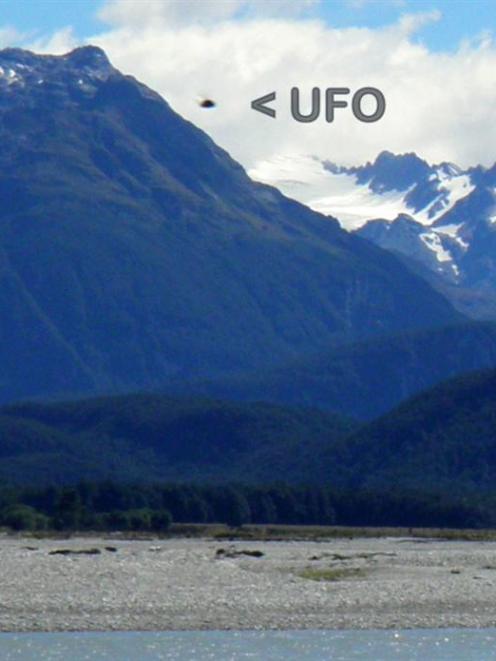 Queenstown man Verdun Waghorn is mystified by the unidentified flying object in this photo, which...