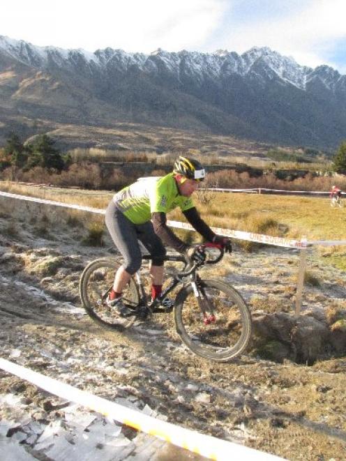 Queenstown Mountain Bike Club member Carey Vivian navigates frozen mud after a downward slope...