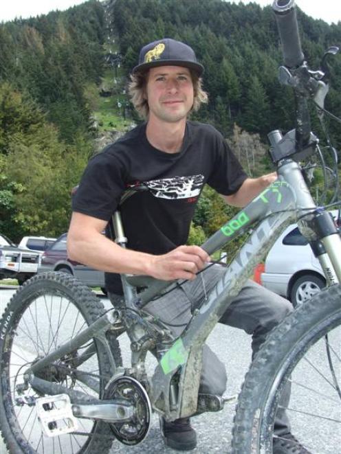 Queenstown Mountain Bike Club president Tom Hey with the bike he intends to sell - among many...