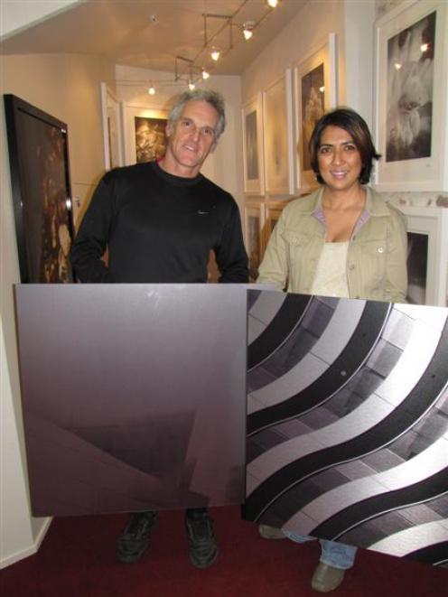 Queenstown photographers Kevin Wakeling and Marina Mathews with two examples of Ms Mathews'...