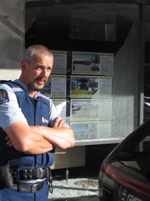 Queenstown Police Constable Terry Erseg was called to a mystery broken window on Athol St, on...