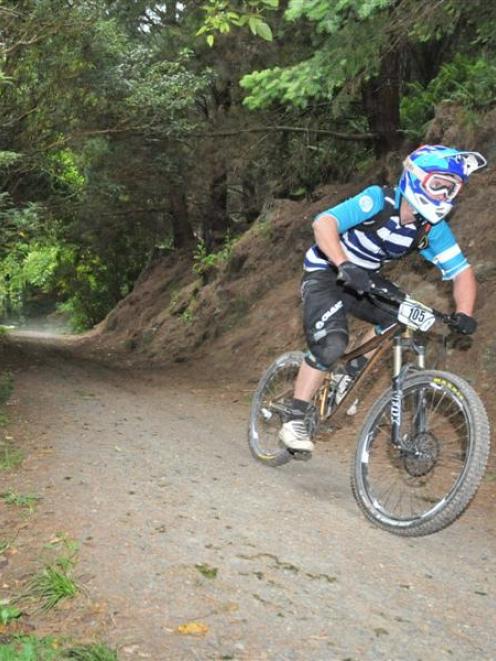 Queenstown rider Blair Christmas blasts down the Mt Cargill section of the Three Peaks Enduro on...