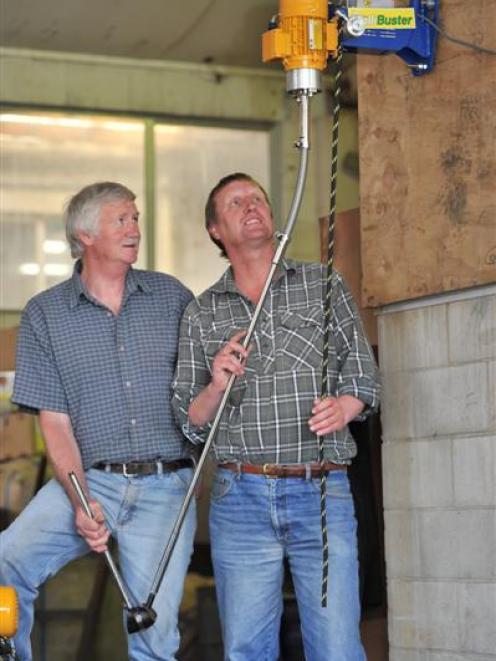 R. J. Wilson (left), from Shearing Services, and P & W Engineering general manager Bob Adams try...